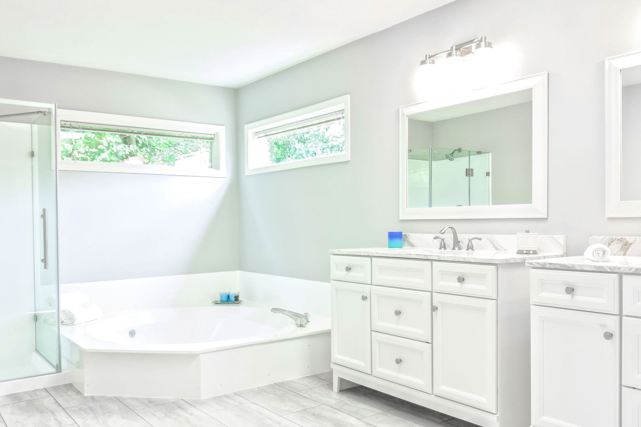 Family Bathroom A white bathroom with a tub and sink.