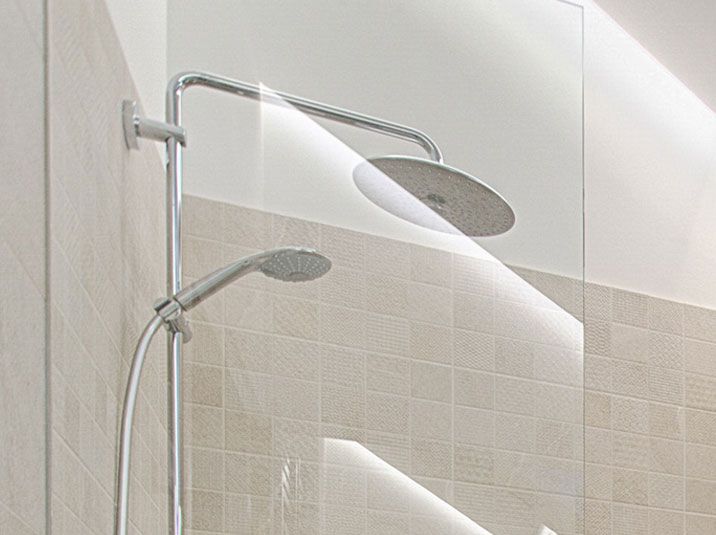 A shower head in a bathroom.